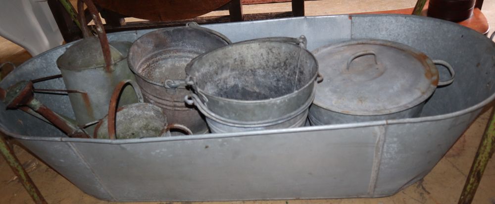 A tin bath, buckets, watering can etc